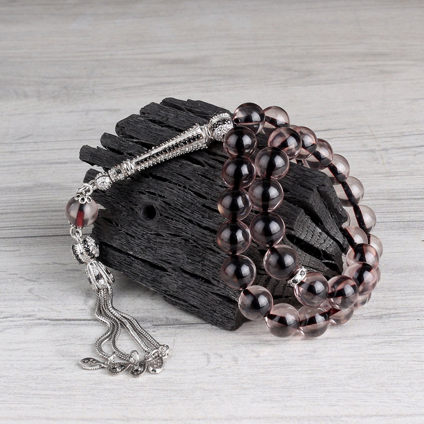 Globe cut black zircon stone fire amber rosary