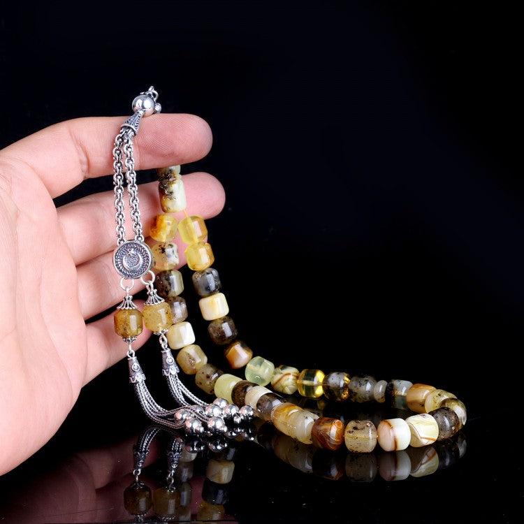 Gebetskette mit 925er Silberkette und zylindrischen fossilen Tropfen-Bernstein-Perlen
