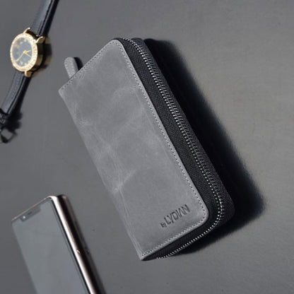 Portefeuille à fermeture éclair en cuir gris avec entrée de téléphone