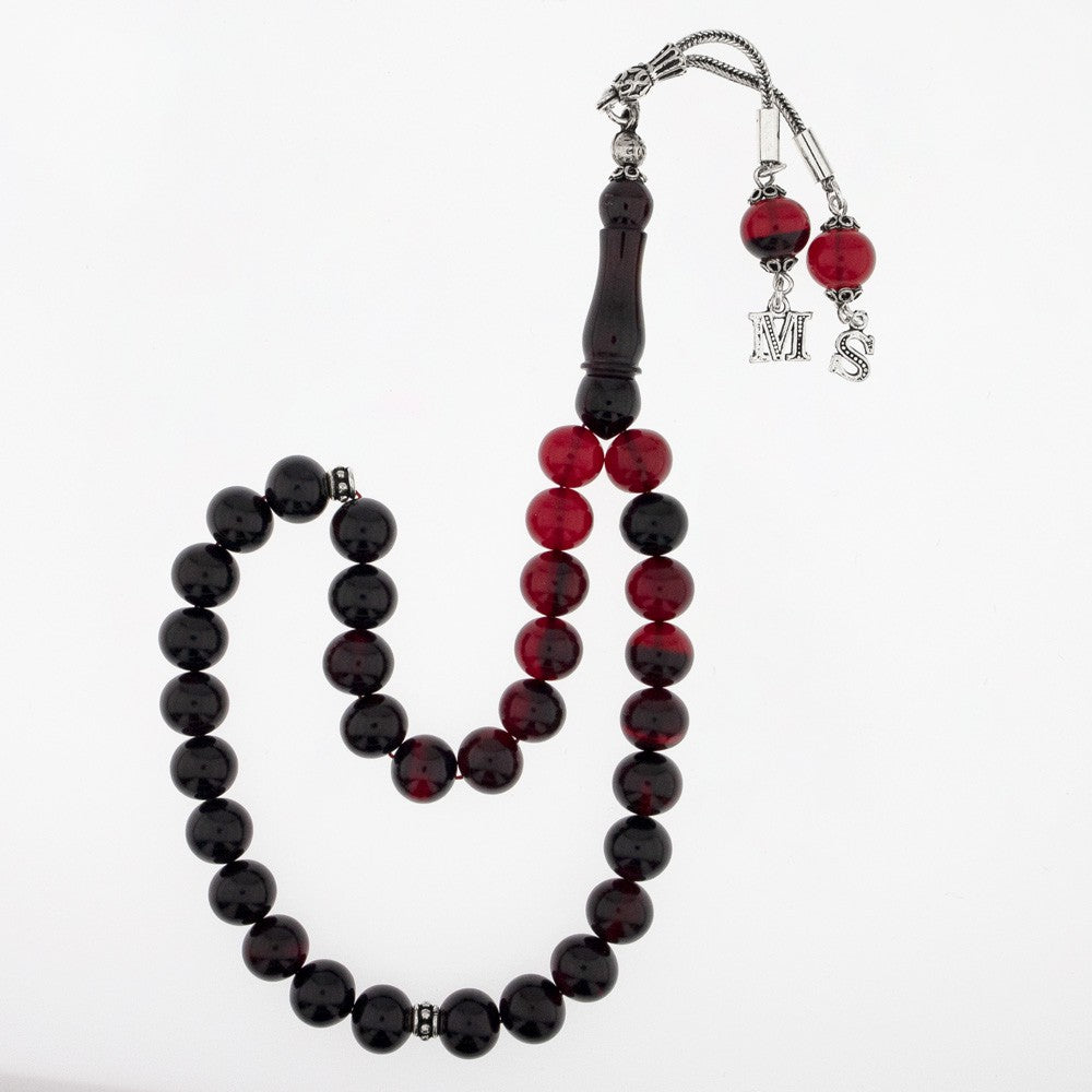 Red filtrate squeezing amber letter silver piece rosary