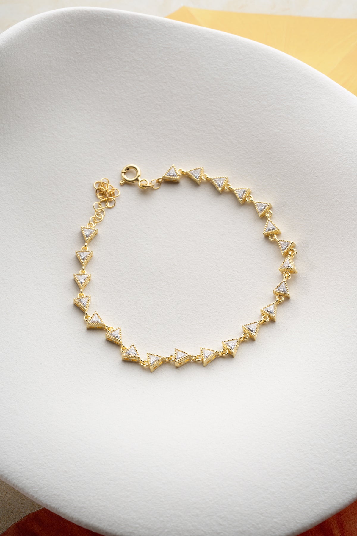 Triangular stone detail gold plated elegant bracelet