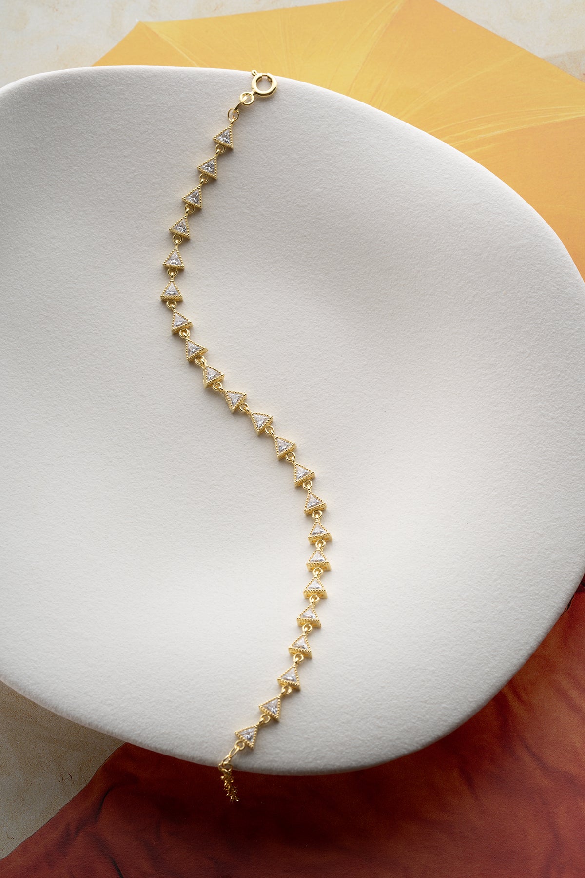 Triangular stone detail gold plated elegant bracelet