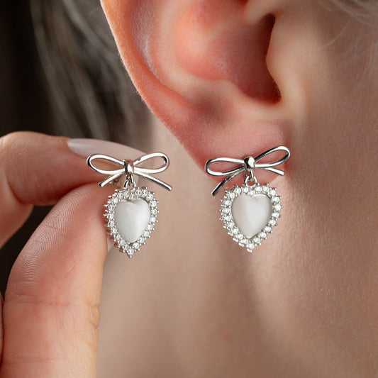 Silver color earrings with heart stone