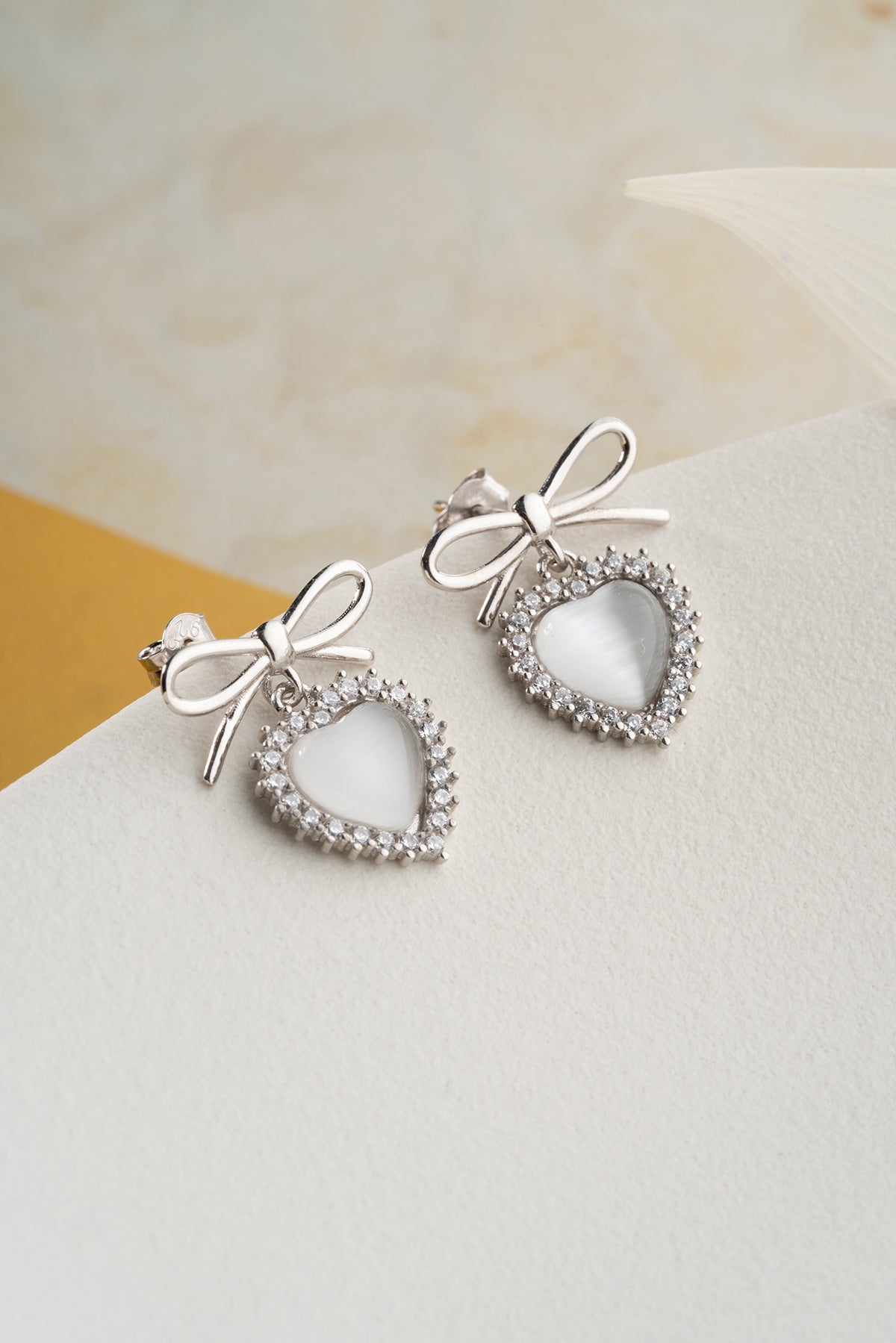 Silver color earrings with heart stone