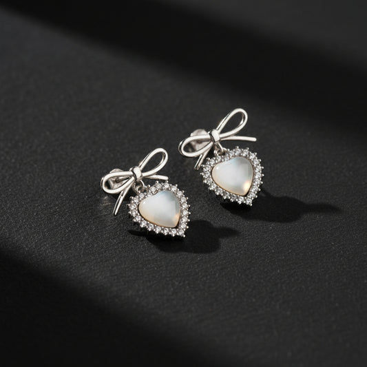 Silver color earrings with heart stone